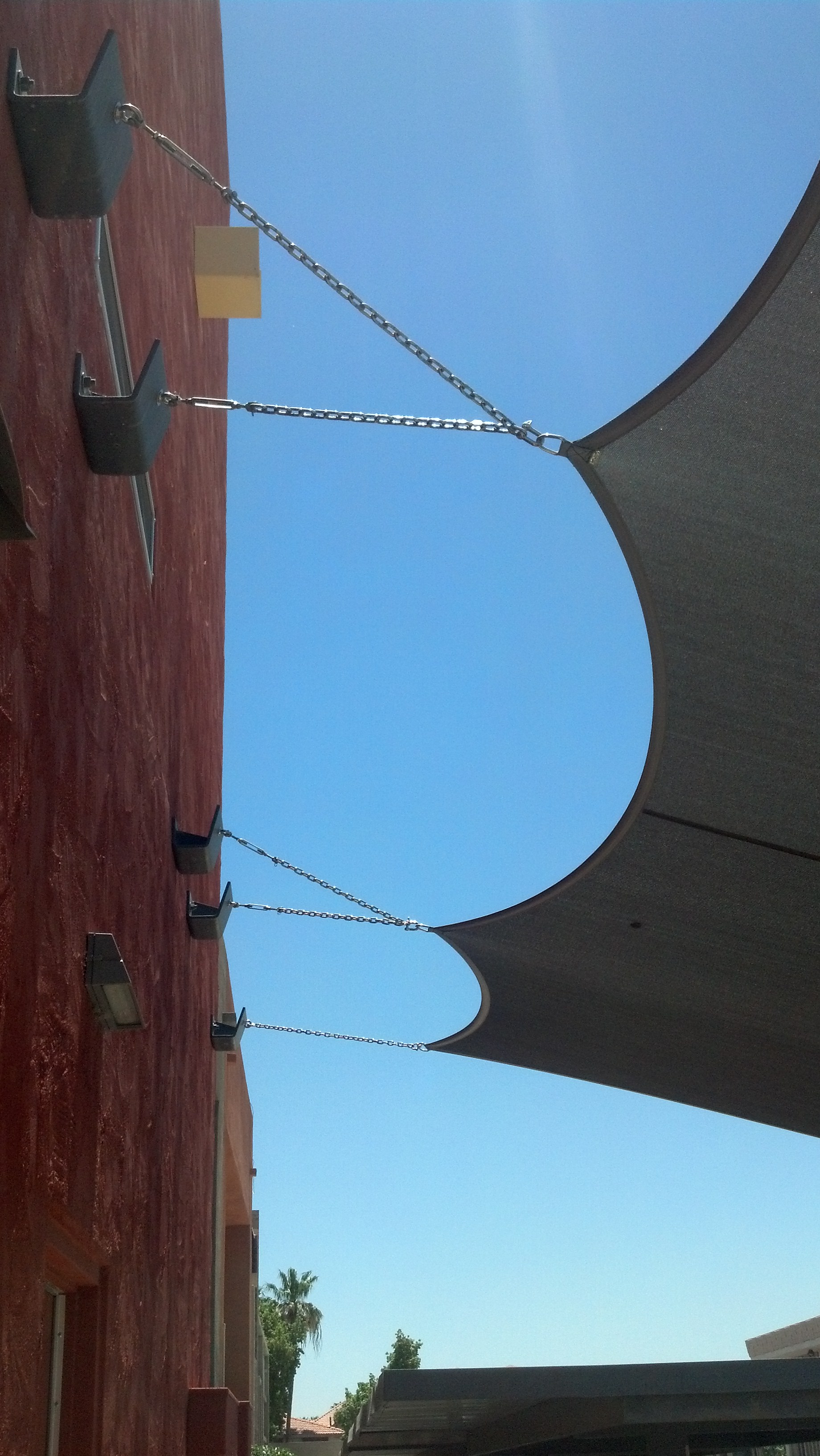 Shade sail wall connections